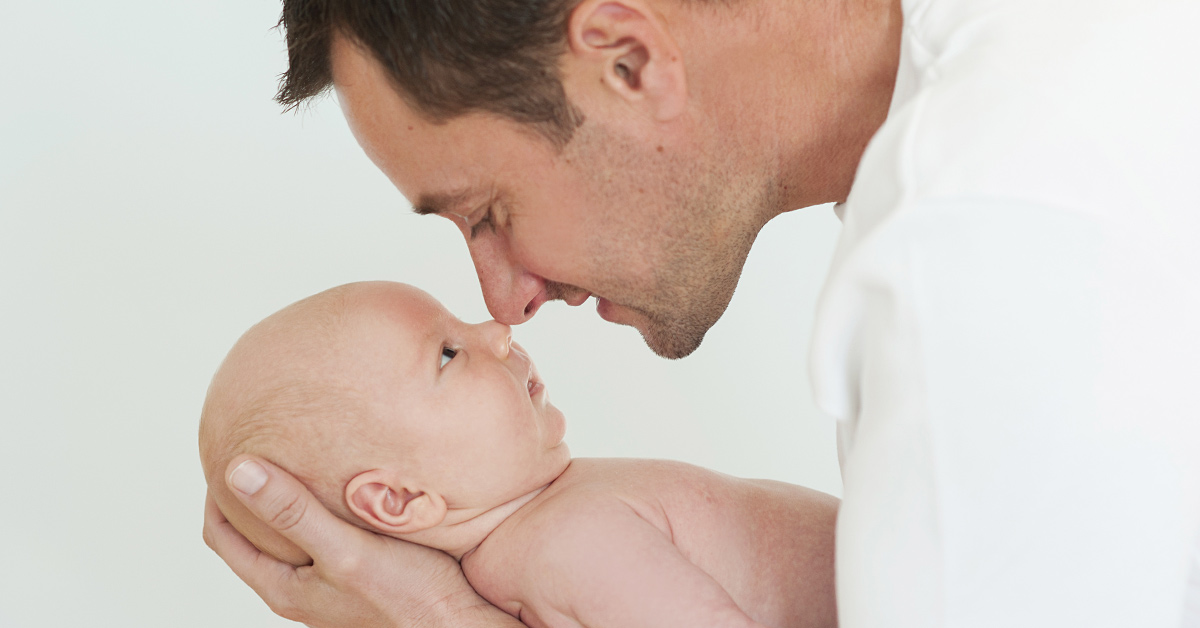 dad holding baby