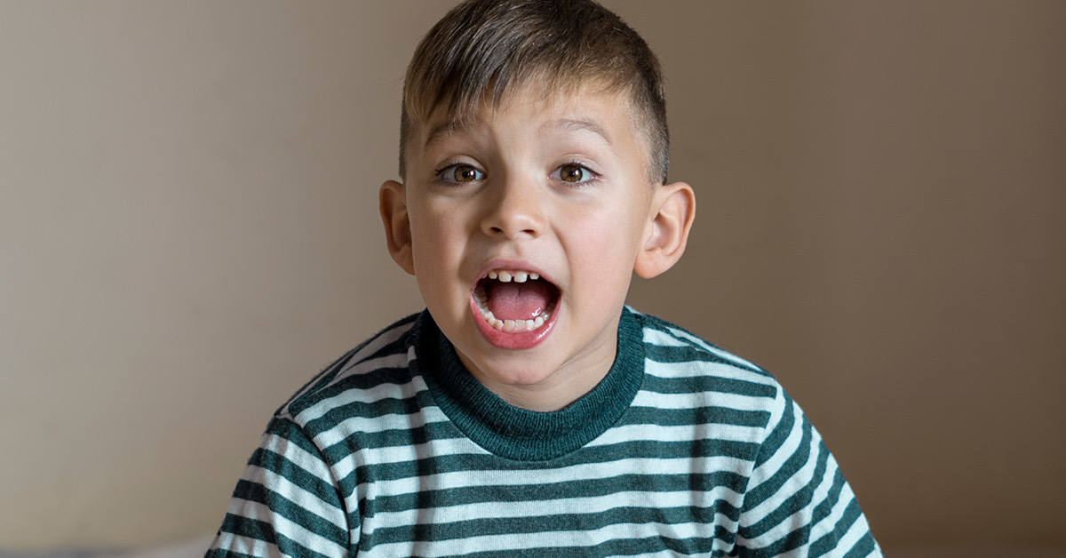 boy in striped green tshirt