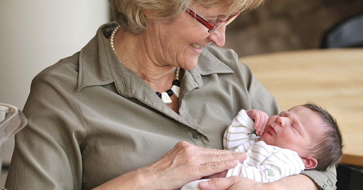 grandmother holding child
