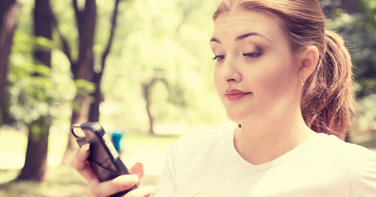 woman looking at phone