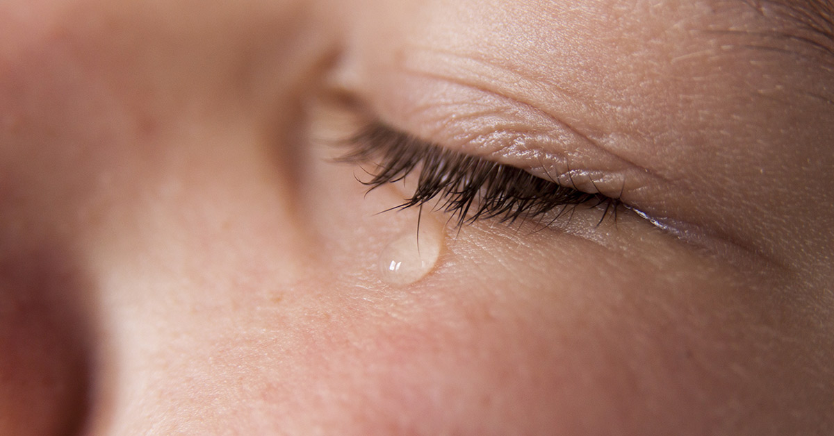 child with tear drop from eye