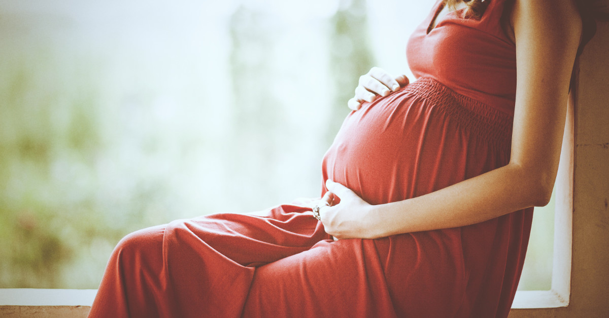 pregnant woman in red dress