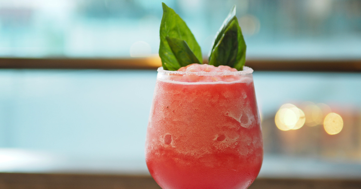 a light pink sangria slushie garnished with mint leaves