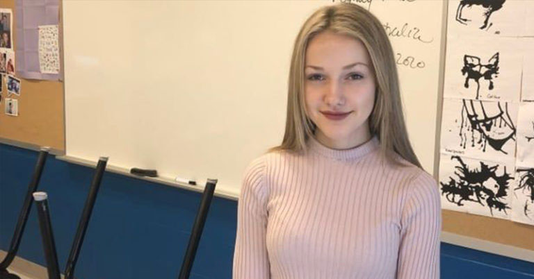 girl in a pink sweater