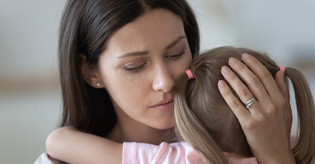 woman holding a girl