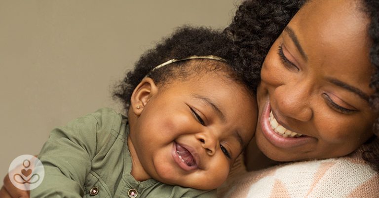 smiling mother and daughter
