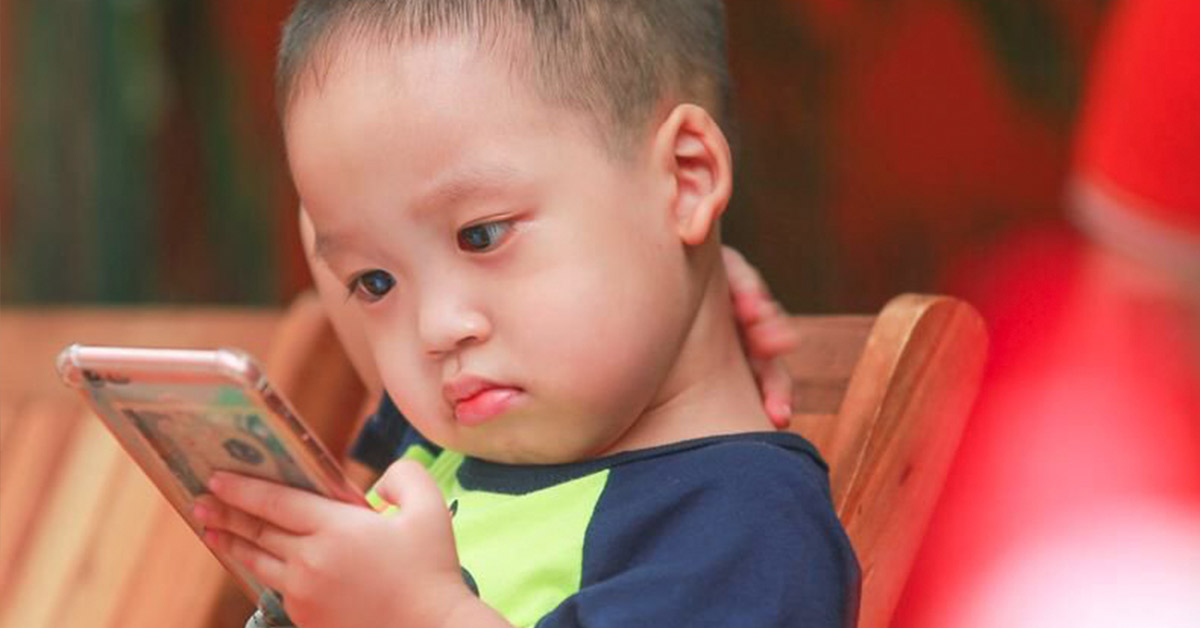 child with a smart phone