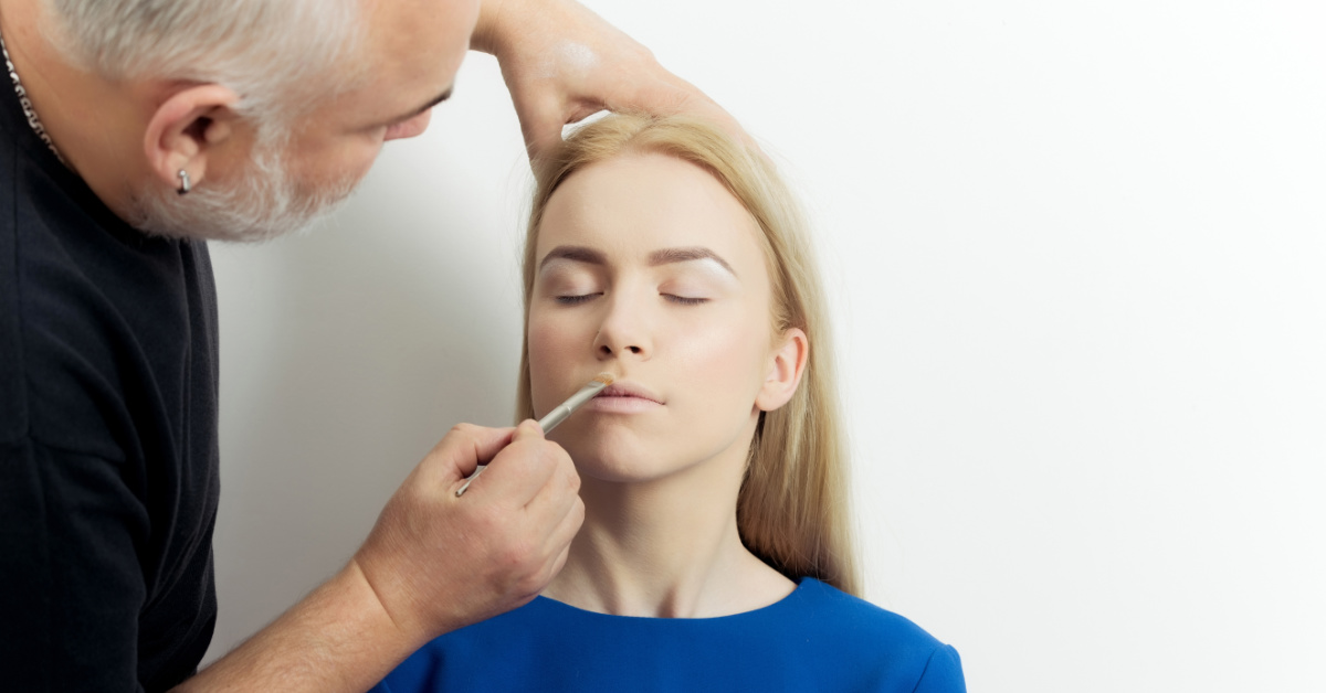 woman having makeup applied