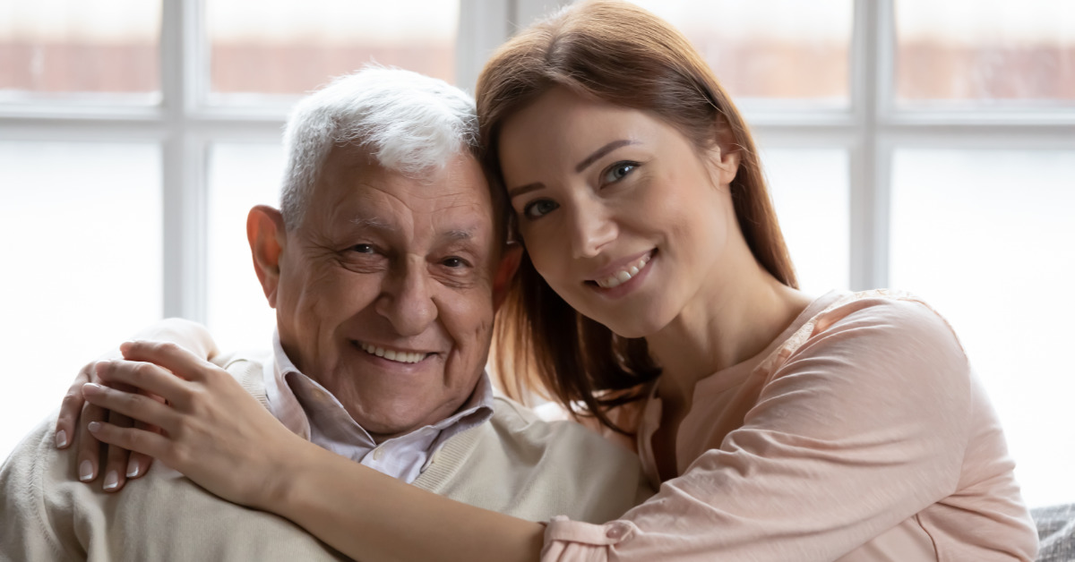 daughter holding her father close