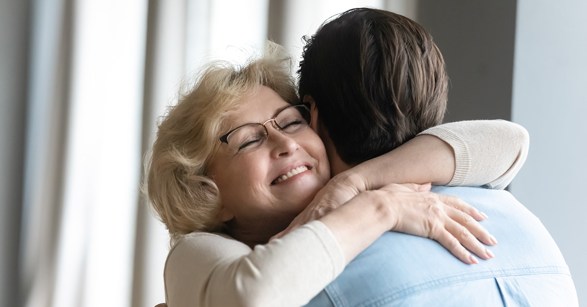 mother embracing son