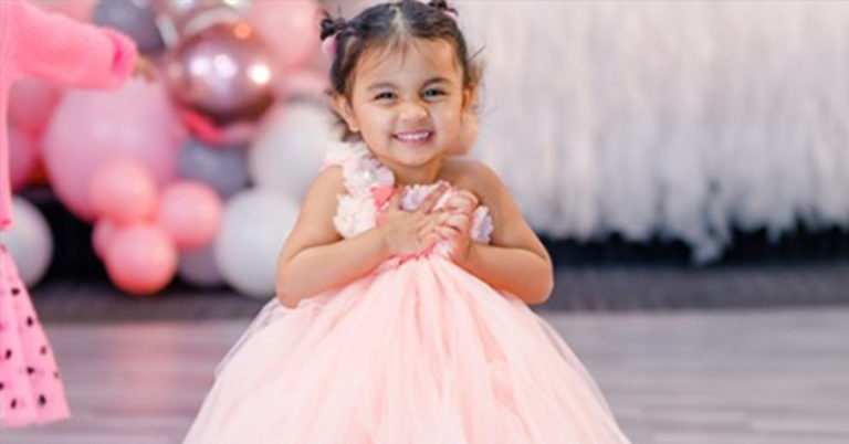 toddler in a pink dress