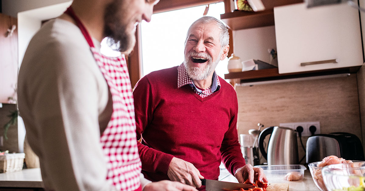 father and son cooking together in a kitchen