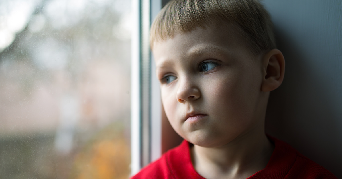 child looking out a window