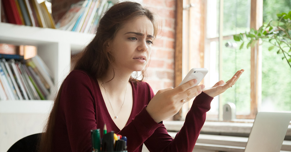 woman frustrated by phone