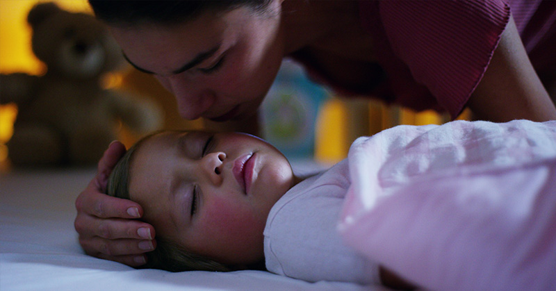sleeping child with mother