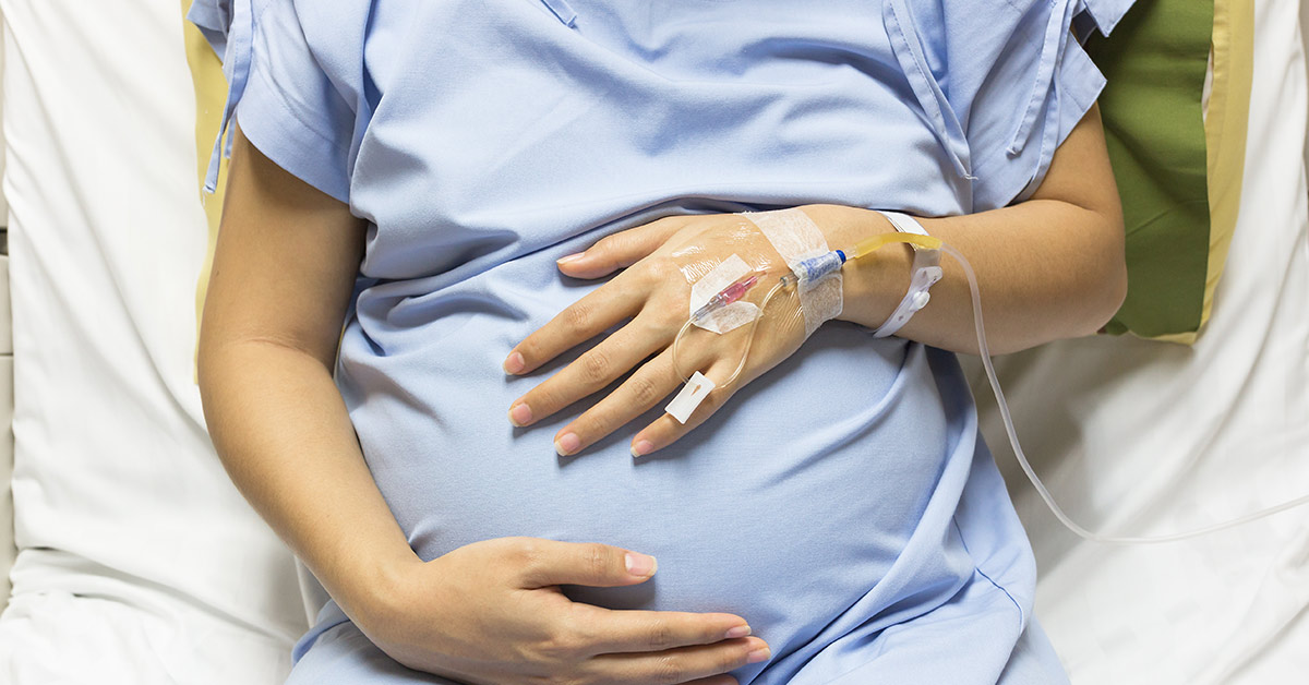 pregnant woman in hospital bed