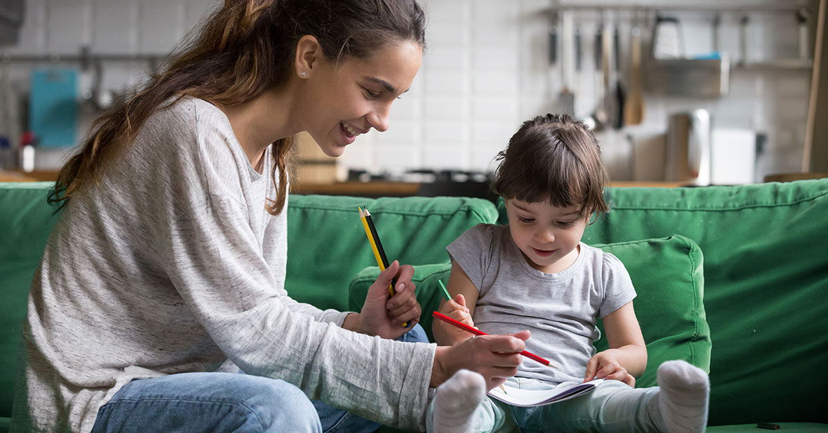 mother doing arts and crafts with her young daughter