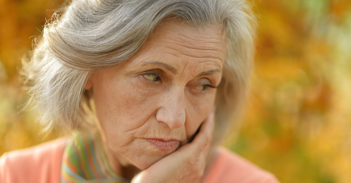 elderly somber woman