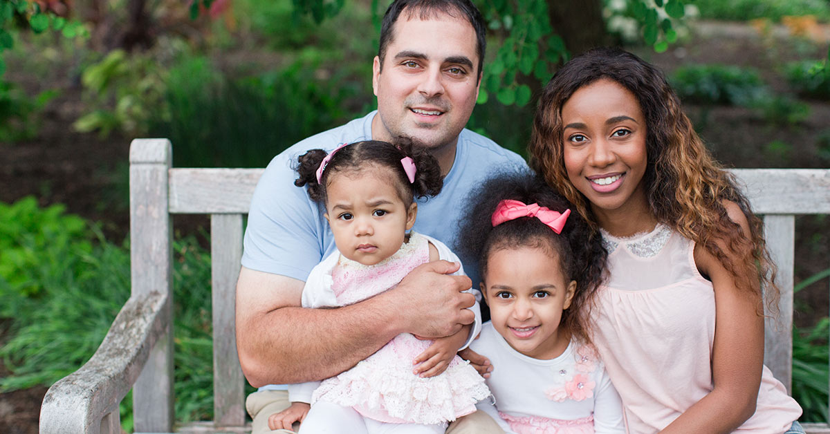 family photo on a white bench