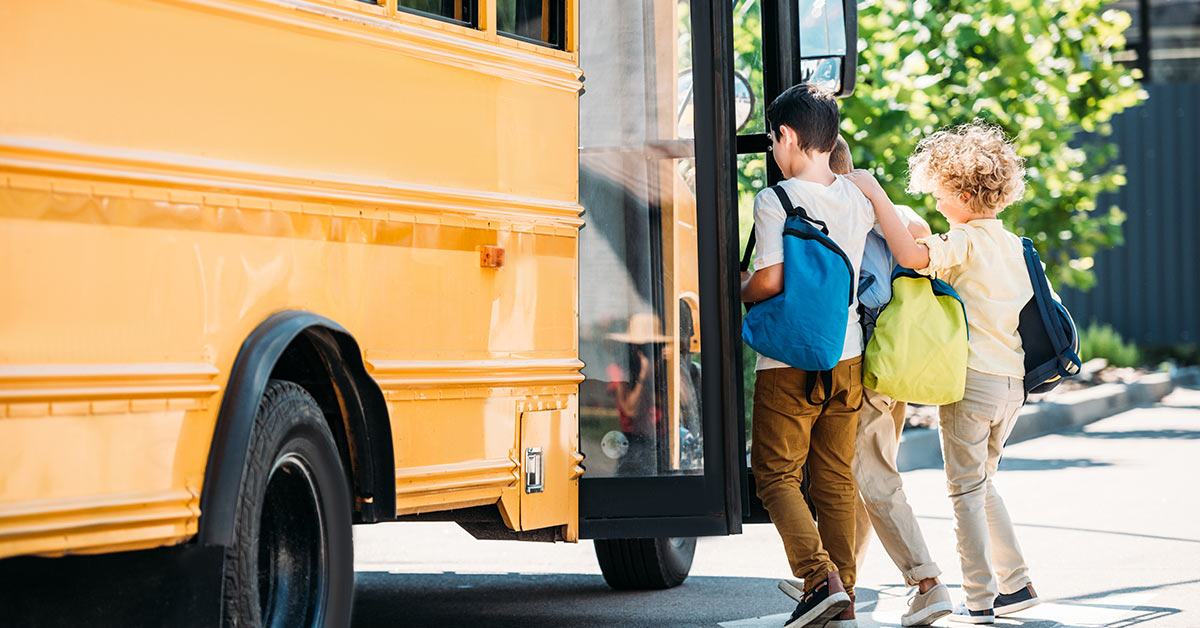 children boarding school bus