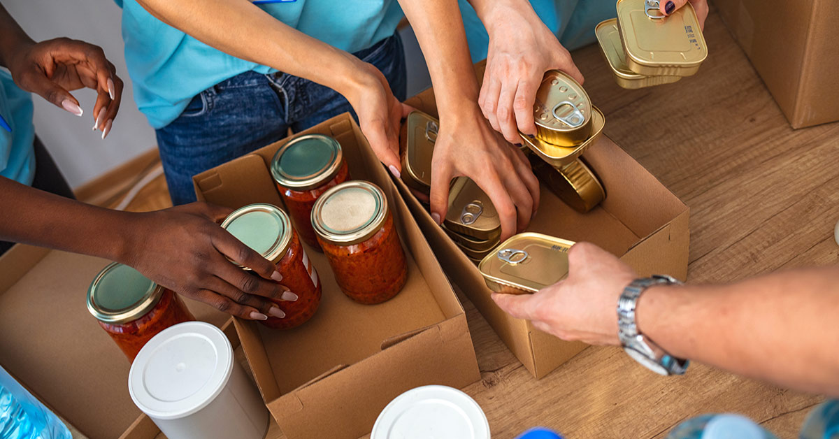 non perishable foods being packaged into cardboard boxes