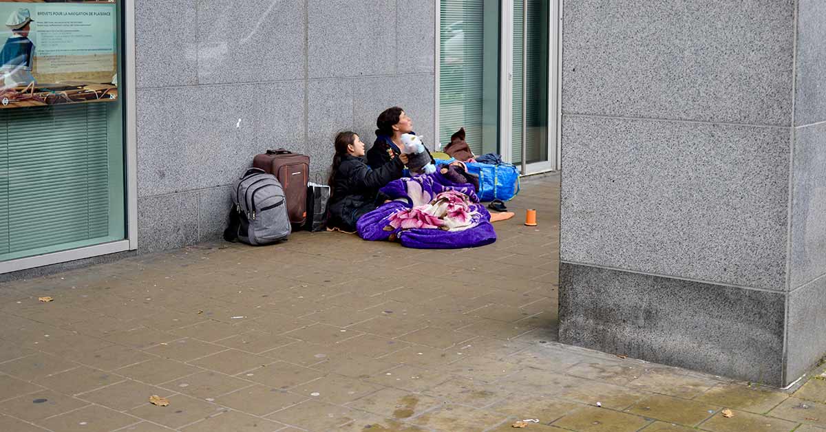 homeless children and mother on the street