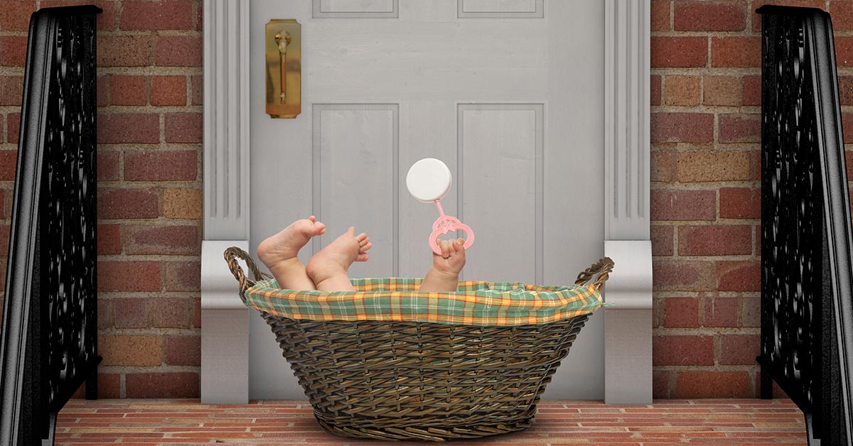 child in a basket on the porch