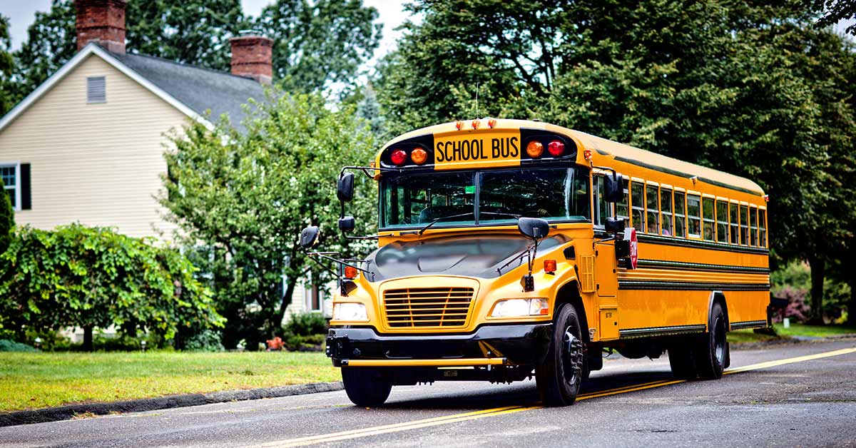 yellow school bus on residential street