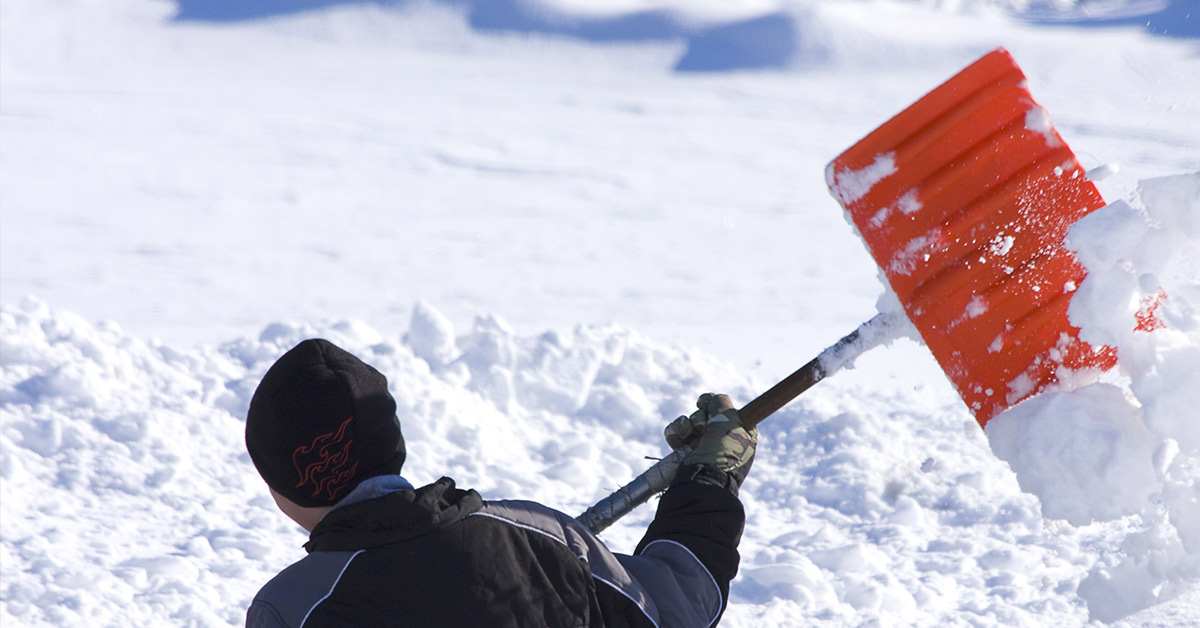 man shoveling driveway