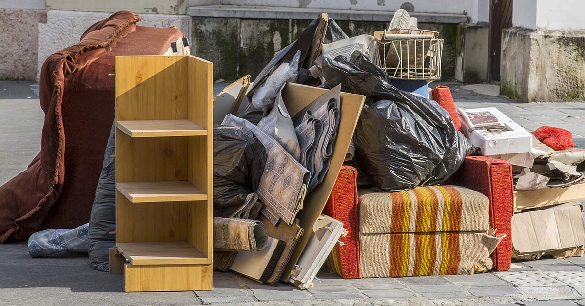 various belongings set out on a sidewalk