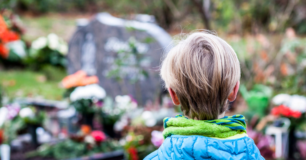 boy at gravestone