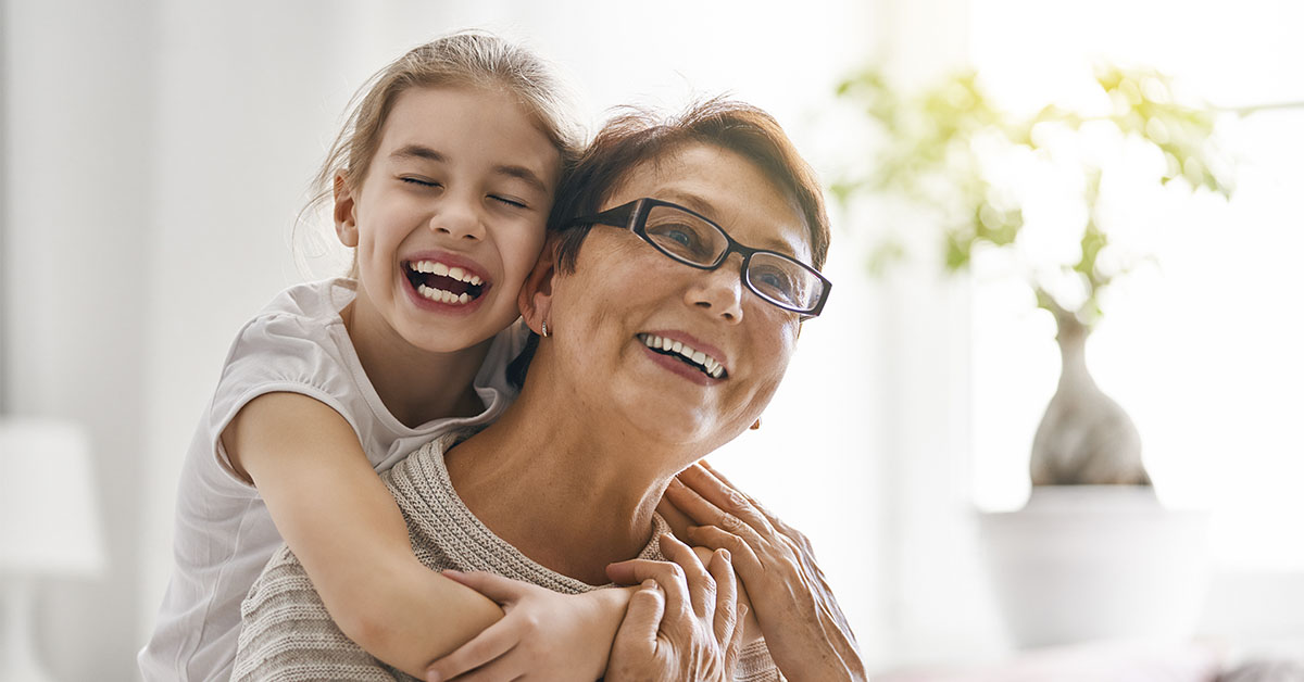 middle aged woman with child on back