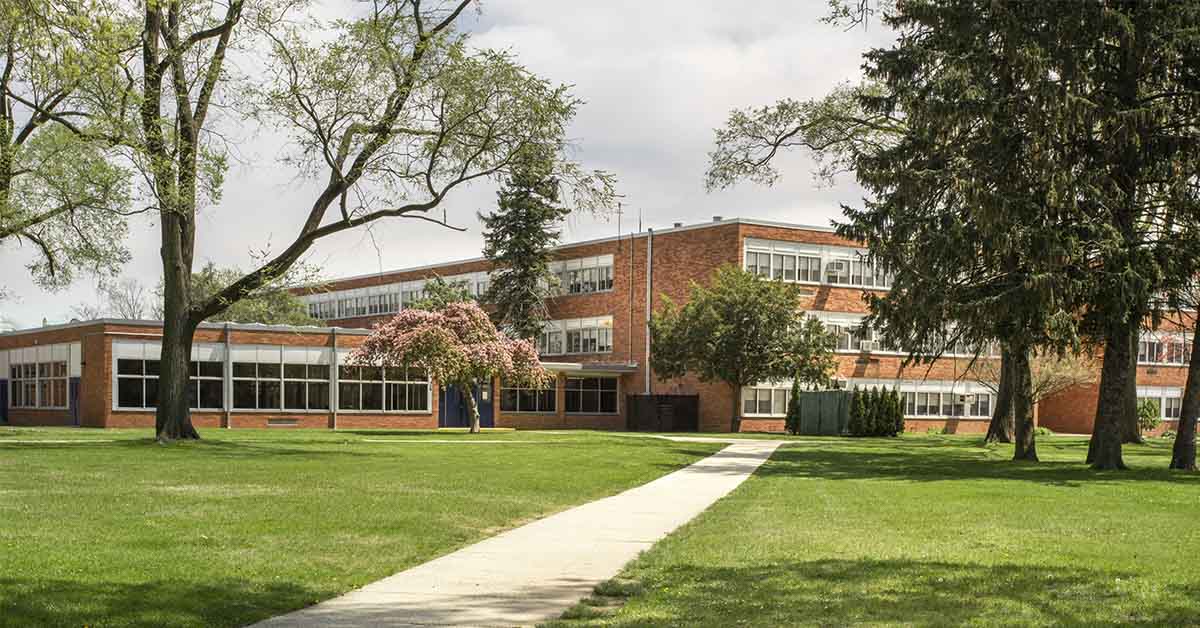 a school with a grassy front yard