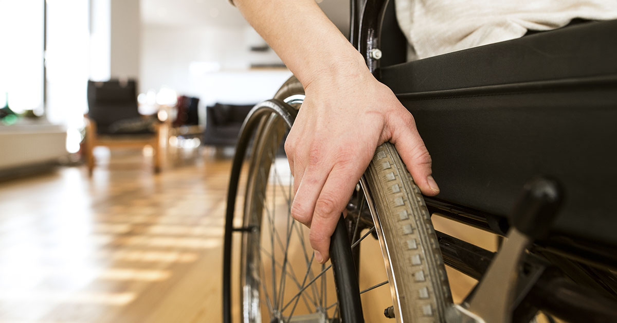hand on wheelchair wheel