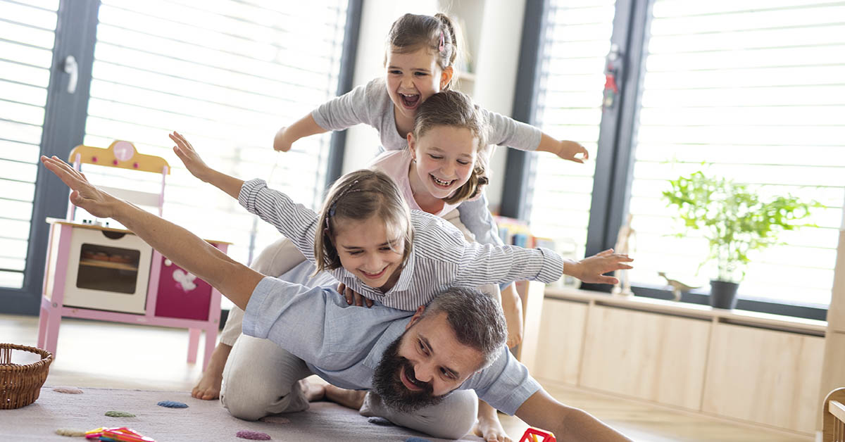 family playing on fathers back