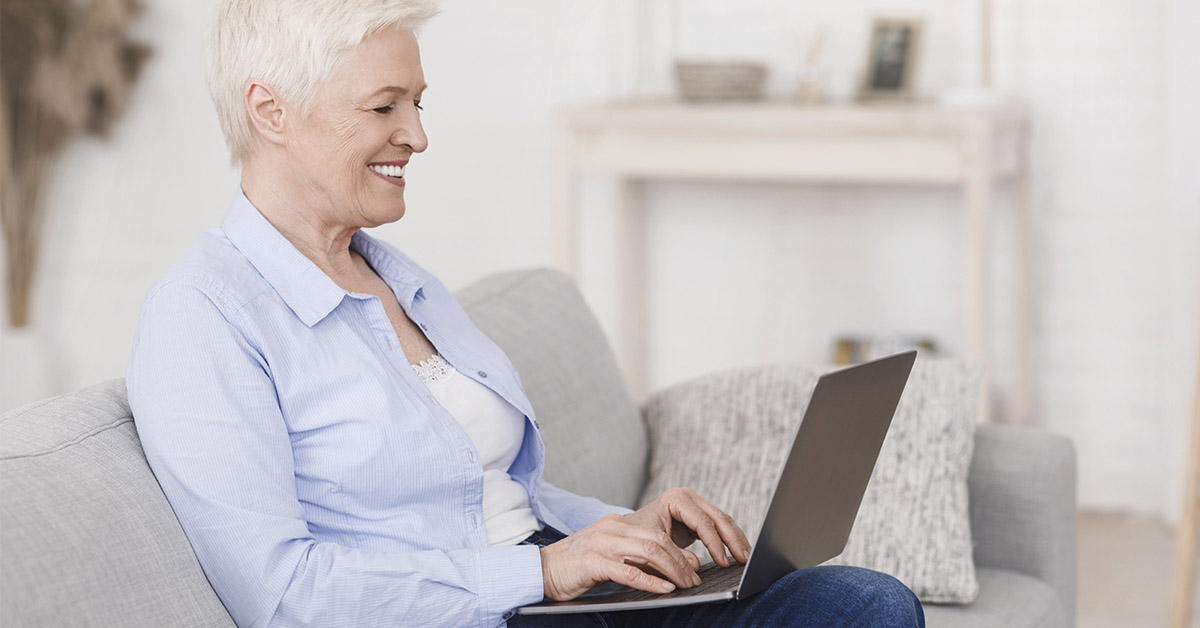 elderly woman using laptop