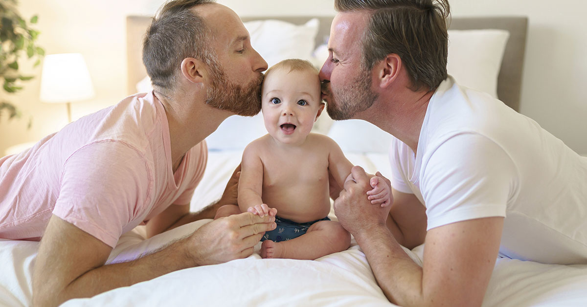 gay couple and their adopted baby