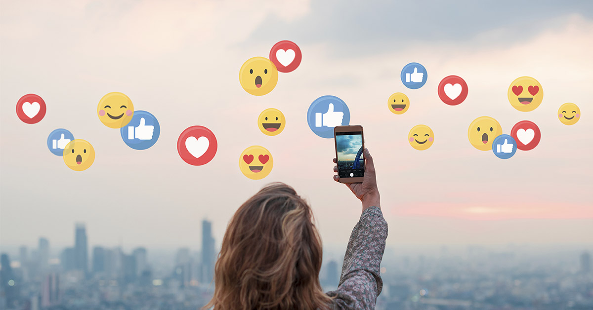 influencer taking a photo of the skyline of a city. Likes and reactions can be seen superimposed