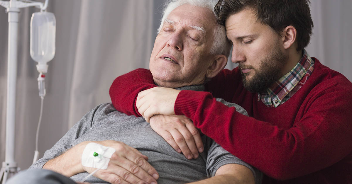 son embracing dying father