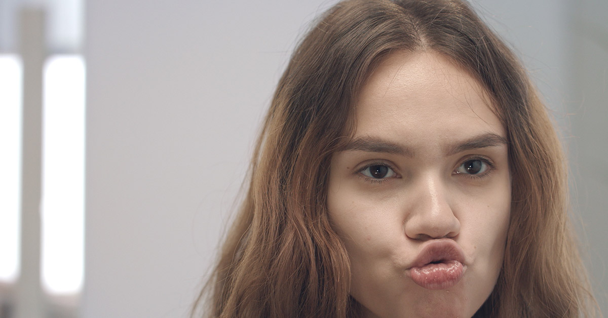 woman making a kissing face