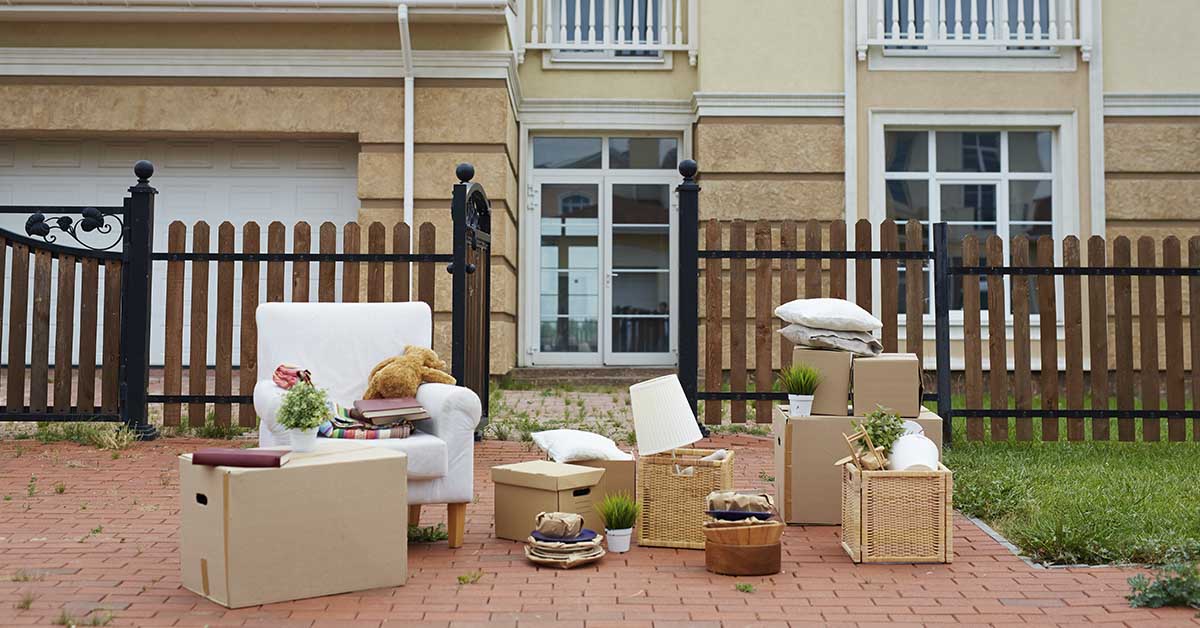 persons belonging sitting in front area of a home