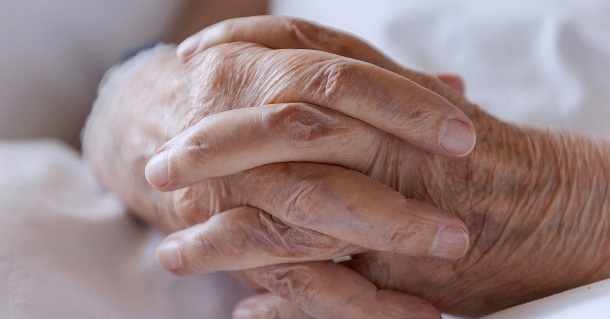 close up of elderly hands holding