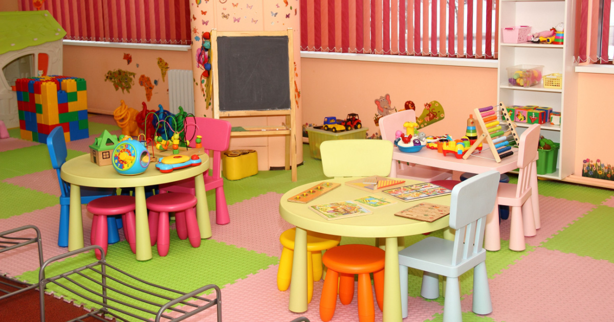 Interior of modern kids playing room in the kindergarten - children's entertainment, recreation, sports, educational games indoor, daycare