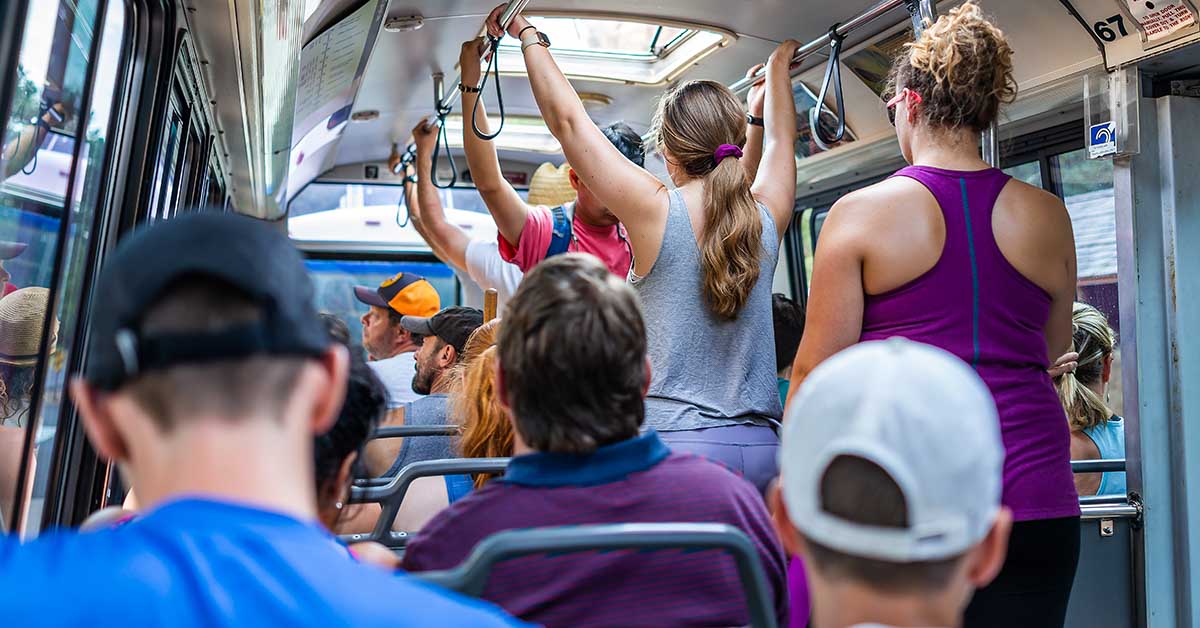 passengers standing on city bus