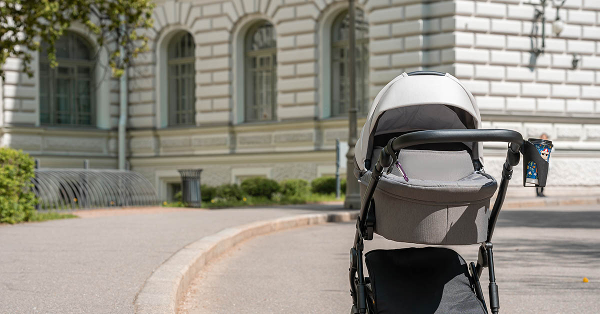 lone baby stroller on sidewalk