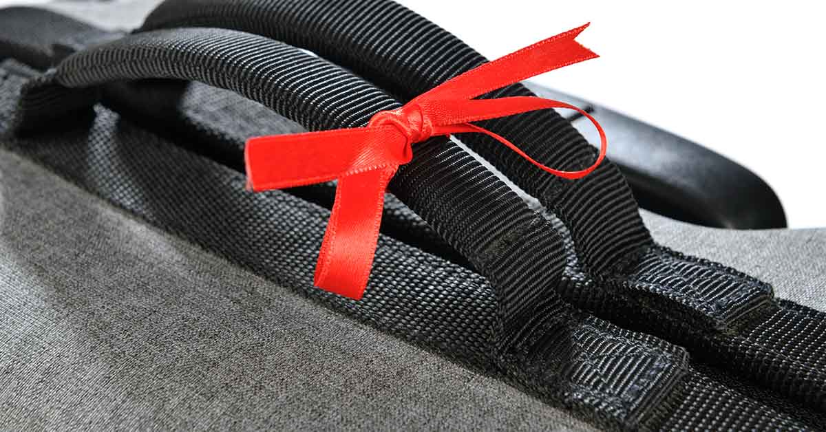 ying Ribbons Onto Luggage