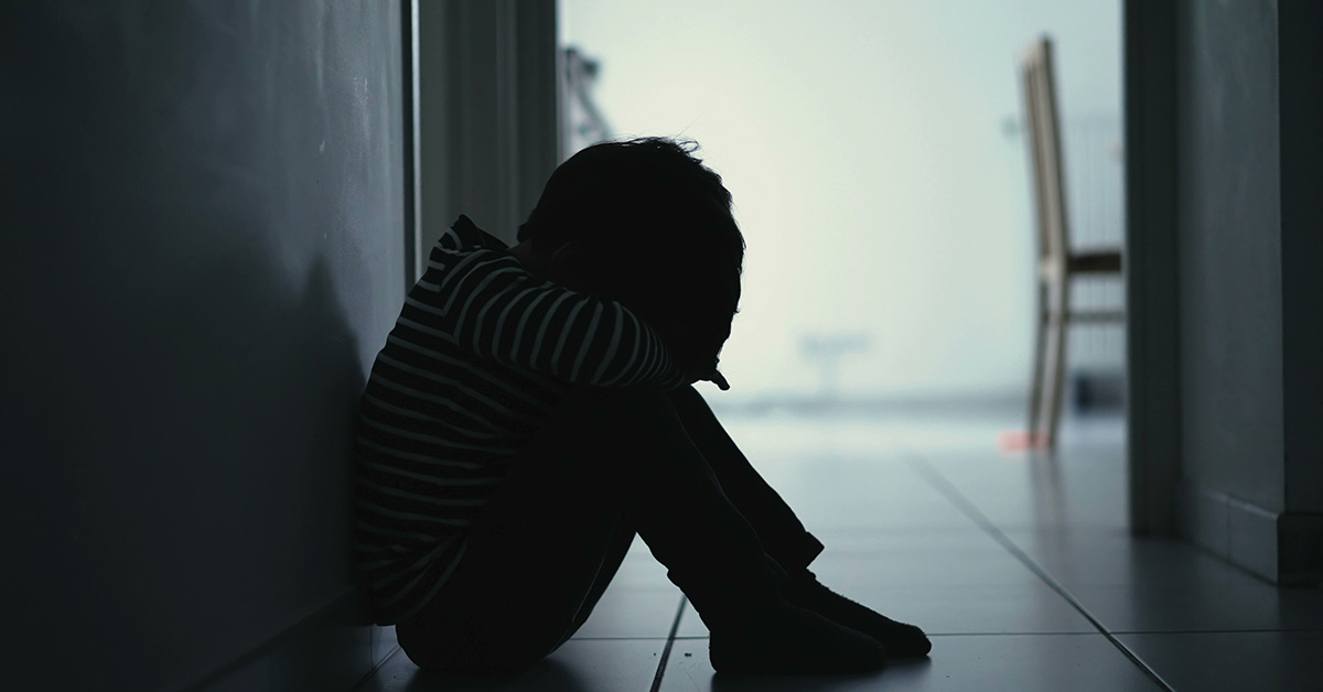 silouhette of woman sitting in her home. Mental health concept