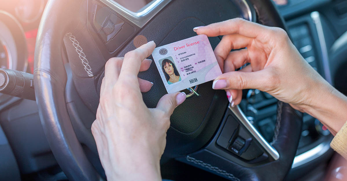 hands holding id