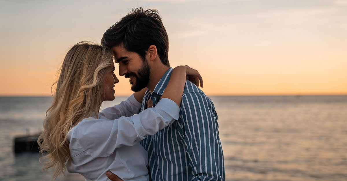 Couple embracing on the beach. In love couple.