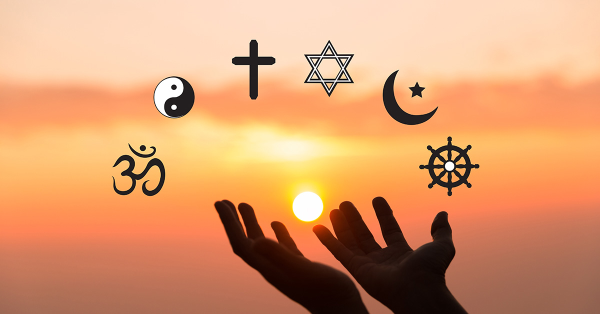 hands held up to the sky and sunset. Various symbols of different religions above the hands